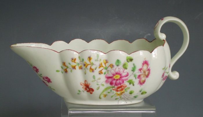 Derby porcelain fluted sauceboat with scroll handle.